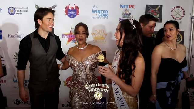 Jacki Nova and Richard Ryan with Amanda Brooke Ford on the red carpet at the Lux...