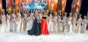 Full group photo of Playboy Playmate Olga Loera and Fashion Designer April Black Diamond on stage with the 2025 Miss & Mrs. Asia USA delegates after the grand finale, captured by Red Carpet Series.